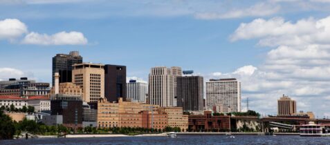 Downtown St. Paul skyline along the Mississippi River on a sunny day, highlighting the vibrant cityscape—perfect for showcasing moving companies St Paul and local relocation services.