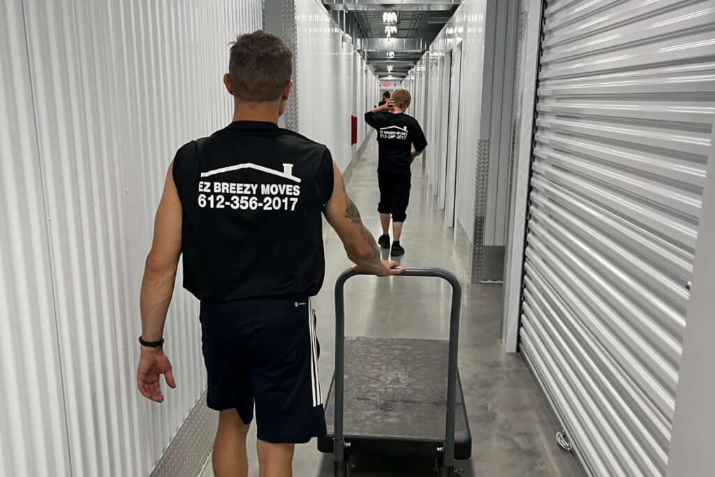 EZ Breezy Movers team navigating a storage facility during a Minneapolis move.