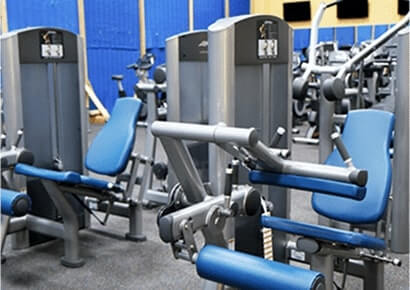 Strength training machines in a Minneapolis gym prepared for relocation by EZ Breezy Movers, expert exercise equipment movers in Armatage, MN.
