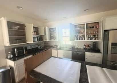 Professional packing crew from EZ Breezy Movers providing packing services in a Linden Hills home.