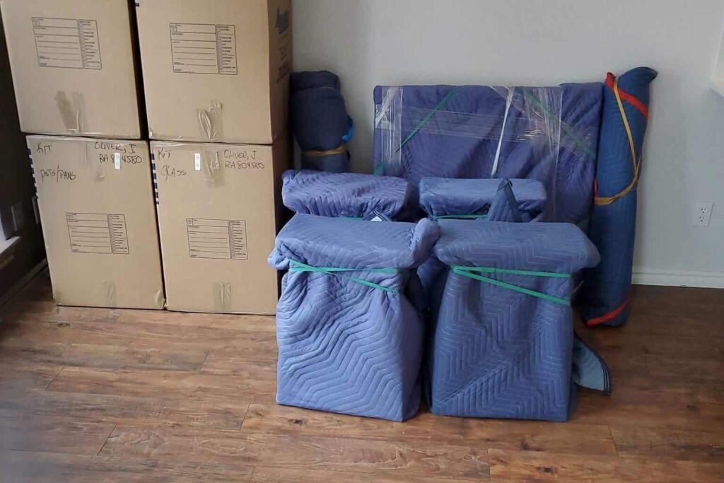 Packed and wrapped furniture and boxes ready for apartment move in St. Paul.