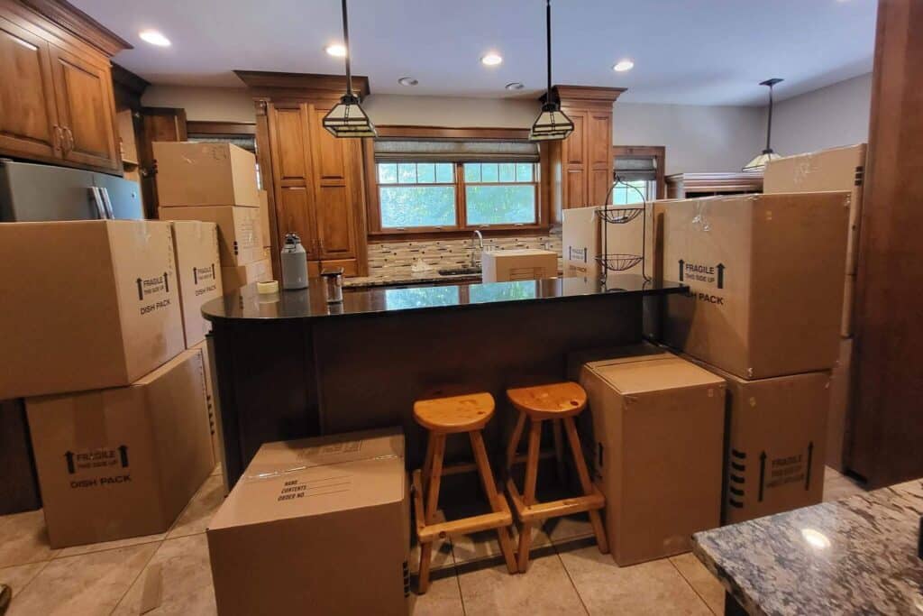 A professionally packed kitchen in Minneapolis, filled with moving boxes and ready for our Labor Only Movers Twin Cities crew to load them into a truck.